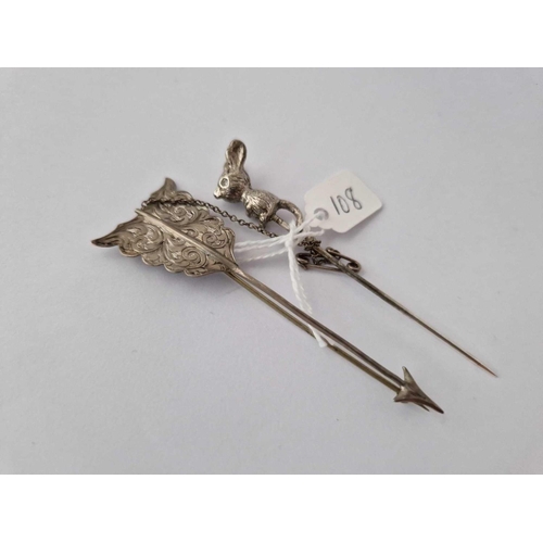 108 - A White Metal Mouse Toped Stick Pin Together With A Silver Arrow Brooch