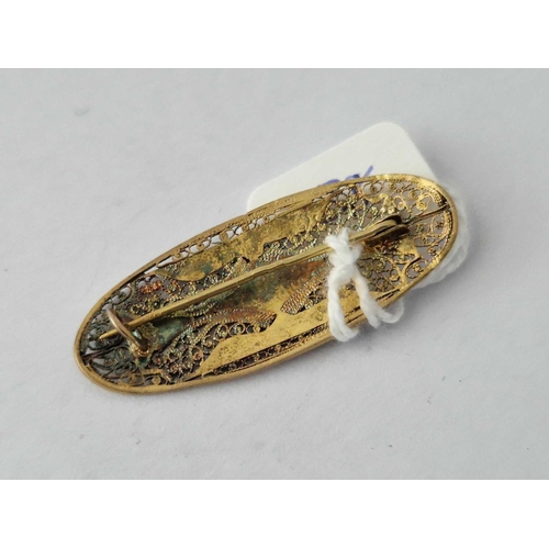 138 - A Filigree And Enamel White Metal Oval Brooch