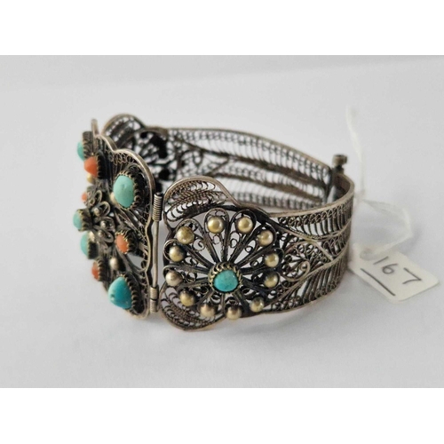 167 - A Sterling Silver Filagree Cuff Bangle Of Eastern Design Decorated With Turquoise And Coral 41 Gms