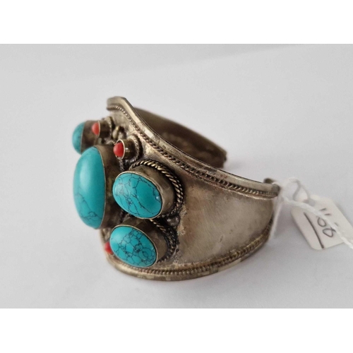 168 - A Heavy Gauge Silver Cuff Bracelet Decorated With Ethnic Coral And Turquoise Stones 81 Gms