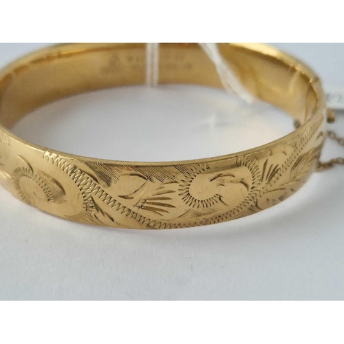 182 - A Rolled Gold Hinged Bangle