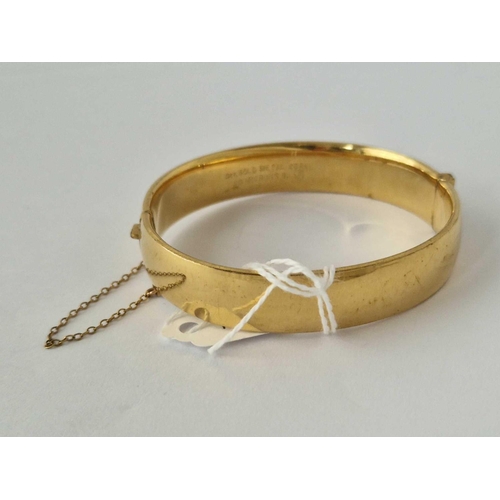 182 - A Rolled Gold Hinged Bangle