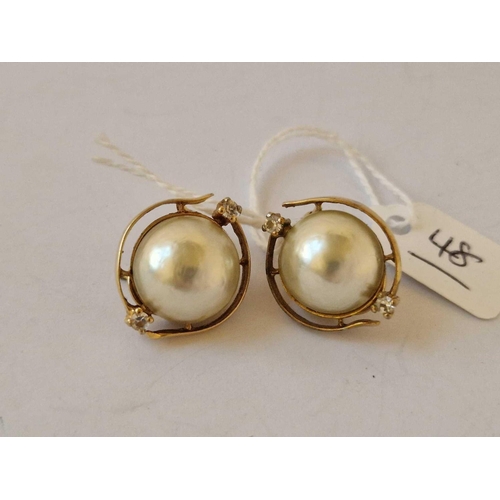 48 - A Nice Pair Of Mabe Pearls And White Stone Earrings Set In Gold