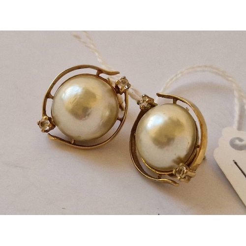 48 - A Nice Pair Of Mabe Pearls And White Stone Earrings Set In Gold