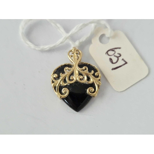 637 - An Onyx Heart Pendant, 14Ct