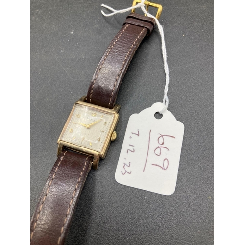 669 - A Gents Square Faced Rotary Wrist Watch