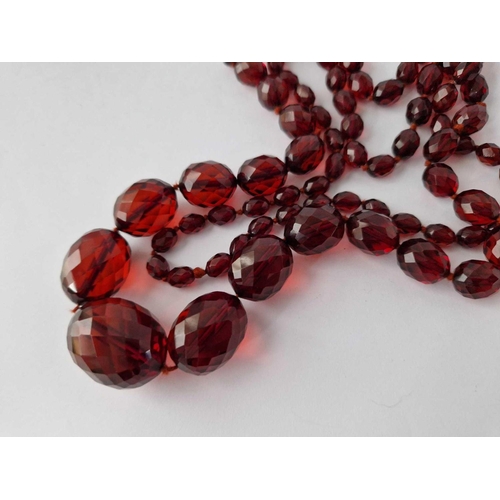 87 - A String Of Faceted Red Bead Necklace And Earrings