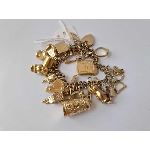 10 - A Impressive Charm Bracelet With Fifteen Plus Novelty Charms 9Ct 7 Inch 35 Gms