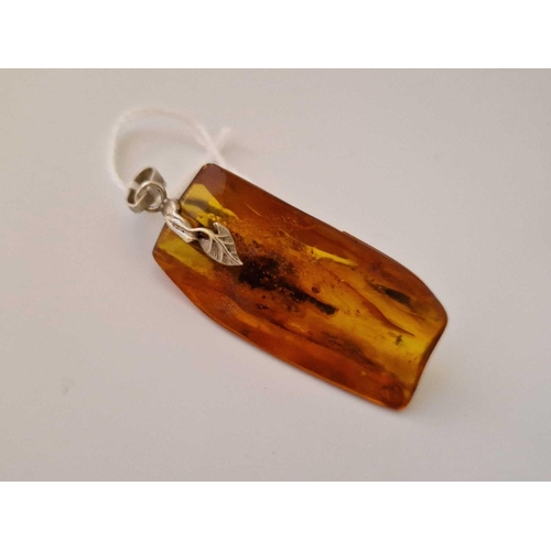 107 - A Silver Amber Pendant