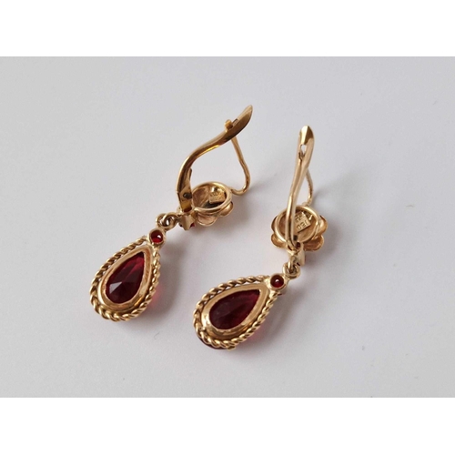 143 - A Pair Of Red Stone Set Earrings 18Ct Gold 6 Gms