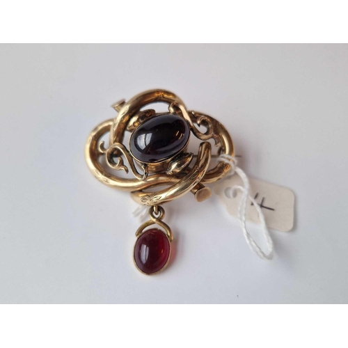 4 - A Victorian Yellow Metal Cabochon Garnet Brooch With Locket Back