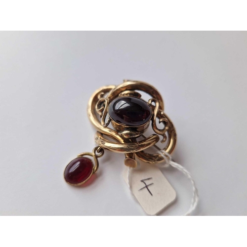 4 - A Victorian Yellow Metal Cabochon Garnet Brooch With Locket Back