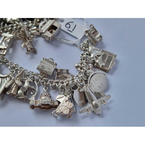 61 - A Heavy Vintage Silver Charm Bracelet 104G With Multiple Silver Charms