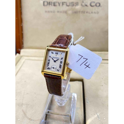 774 - An Oblong Faced Dreyfuss & Co Wrist Watch With Seconds Dial, 18Ct In Large Wooden Display Box, Etc