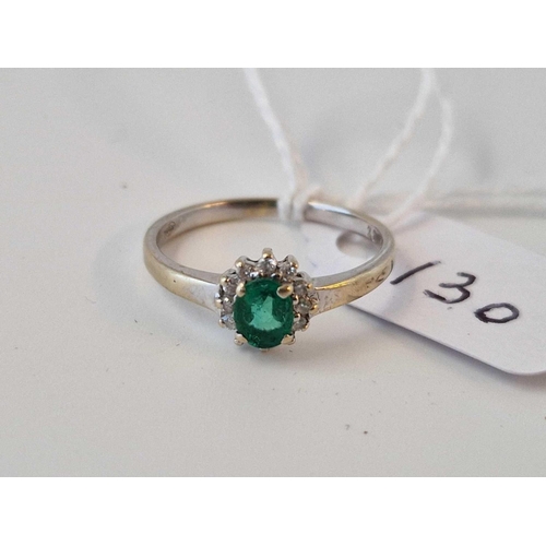 130 - A Emerald And Diamond Oval Cluster Ring 18Ct Gold Size L