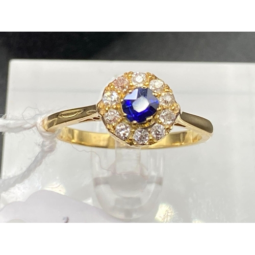 154 - A Pretty Sapphire And Diamond Flower Shaped Cluster Ring In High Carat Gold Size P 3.5 Gms