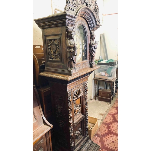 1778 - Decorative 19th C Long Cased Clock In A Heavily Carved Oak Case The Arched Top With Numerous Bells