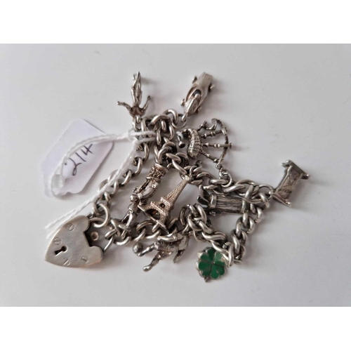 214 - A Silver Charm Bracelet Including A Silver Footballer Charm