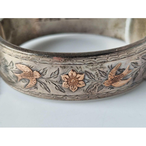 240 - A Silver And Gold Overlay Decorative Wide Bangle