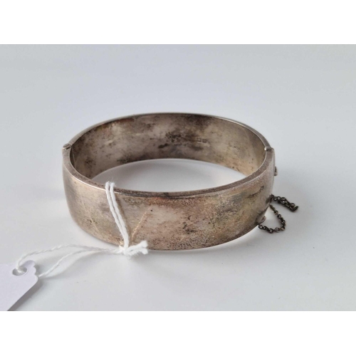 240 - A Silver And Gold Overlay Decorative Wide Bangle