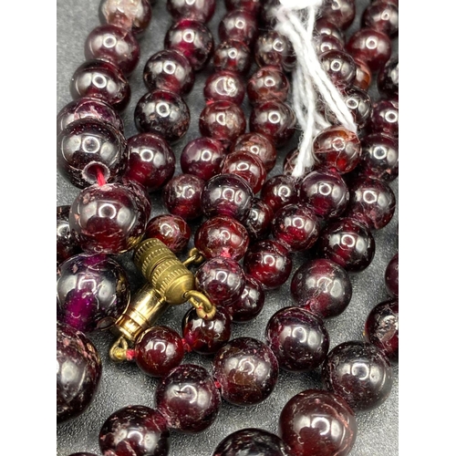 311 - A Pair Of Garnet Bead Necklaces 28 And 24 Inch