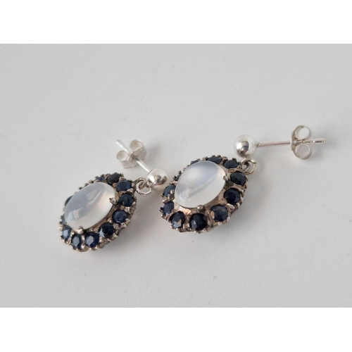 321 - A Pair Of Antique Silver Moonstone And Sapphire Oval Cluster Drop Earrings