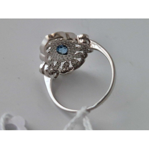 352 - A Fancy White Gold Marquise Ring With Central Blue Topaz Surrounded With Diamonds 9Ct Size S