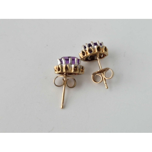 408 - A Pair Of Diamond And Amethyst Earrings 9Ct