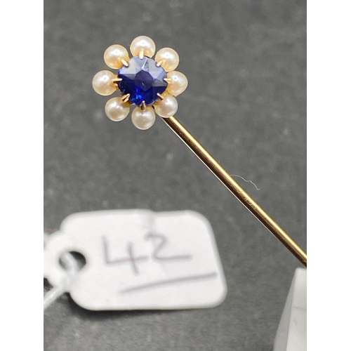 42 - A Victorian Sapphire And Pearl Stick Pin In High Carat Gold