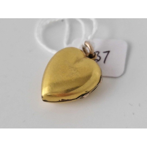 437 - A Gold Plated Heart Locket With Diamond And Red Stones