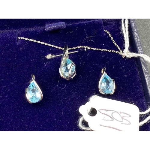 503 - A White Gold Blue Topaz Pendant Necklace And Matching Earrings Boxed