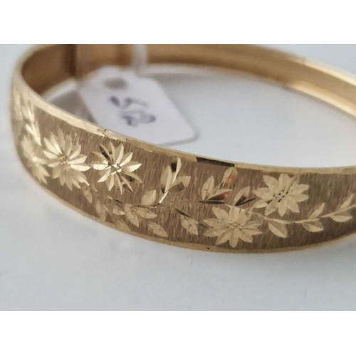 512 - A Engraved Bangle 9Ct 9.6 Gms