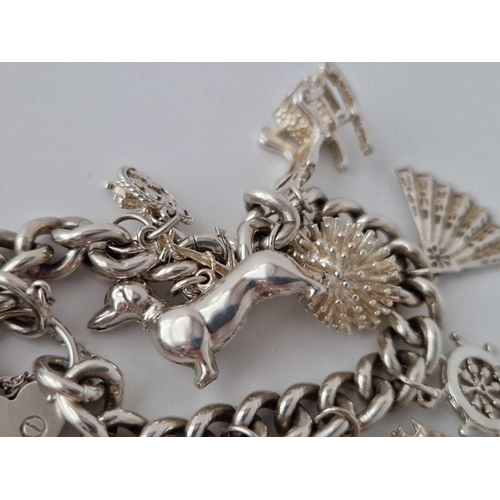 554 - A Silver Charm Bracelet 7 Inch 75 Gms