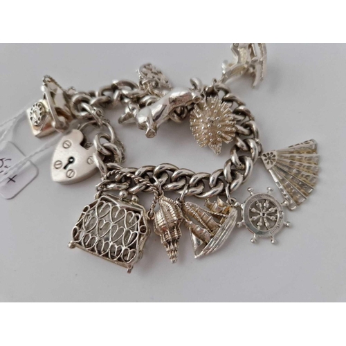 554 - A Silver Charm Bracelet 7 Inch 75 Gms