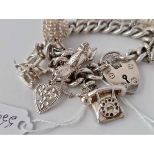 554 - A Silver Charm Bracelet 7 Inch 75 Gms