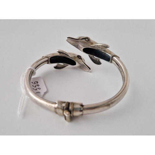 555 - A Silver Dolphin Bangle 42 Gms