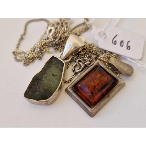 606 - A Silver Square Amber Pendant Necklace And Silver Designer Pendant Necklace