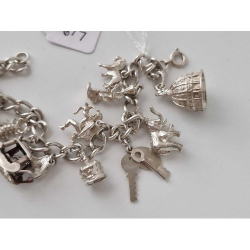 617 - A Silver Charm Bracelet 6 Inch 39 Gms