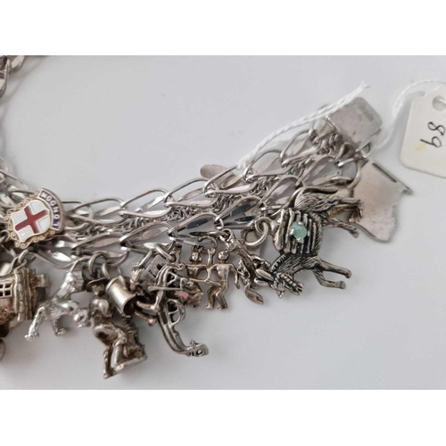 89 - A Large Heavy Silver Charm Bracelet 7.5 Inches 81 Gms