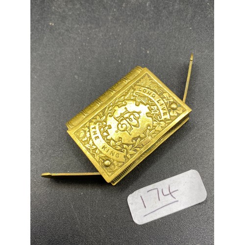 174 - A Gilt Metal Vesta Case In The Form Of A Book Depicting Edward VII