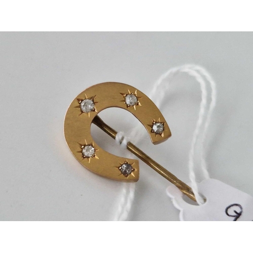 99 - A diamond set horse shoe stick pin 9ct 2.9 gms