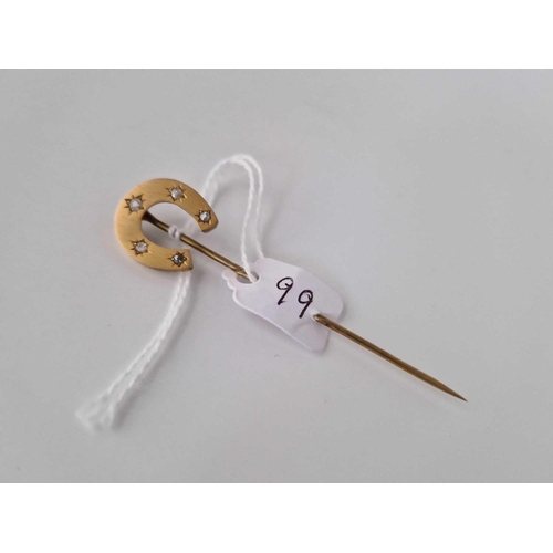 99 - A diamond set horse shoe stick pin 9ct 2.9 gms