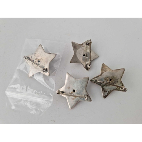 106 - Four sterling silver star brooches