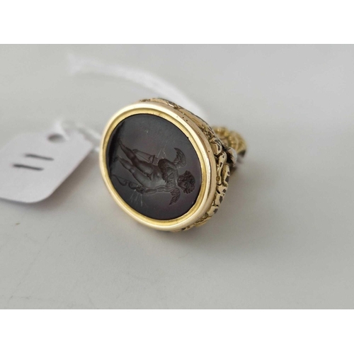 11 - A 19th century gold cased intaglio seal fob with cherub