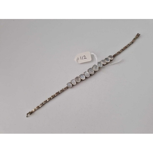 112 - A MOONSTONE AND SILVER BRACELET, 7inch