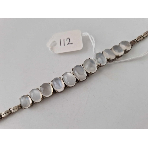 112 - A MOONSTONE AND SILVER BRACELET, 7inch