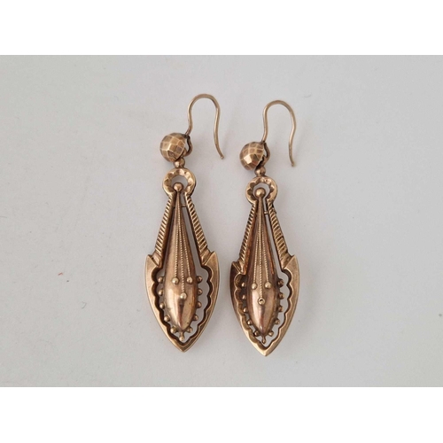 121 - A pair of antique gold drop earrings on shepherds crook fittings 9ct 47mm