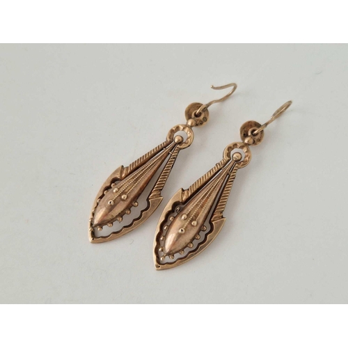 121 - A pair of antique gold drop earrings on shepherds crook fittings 9ct 47mm