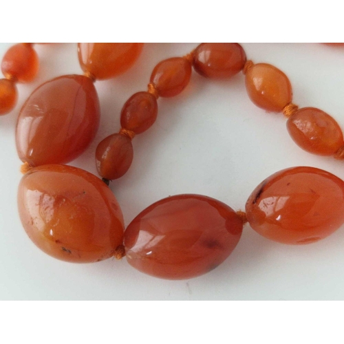 124 - A carnelian oval bead necklace 17 inch