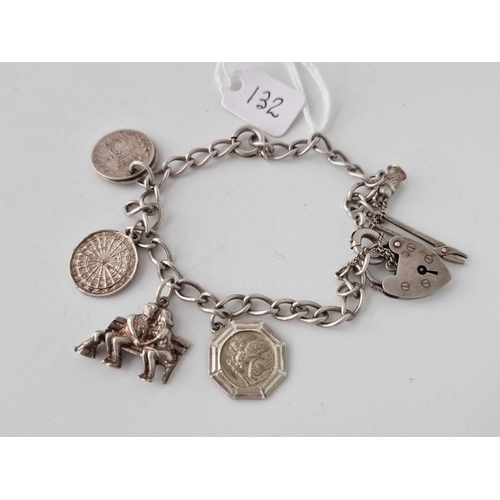 132 - A silver charm bracelet 7 inch